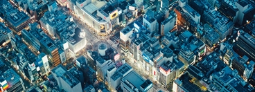 Aerial shot of a junction with skyscrapers in Tokyo, Japan.
